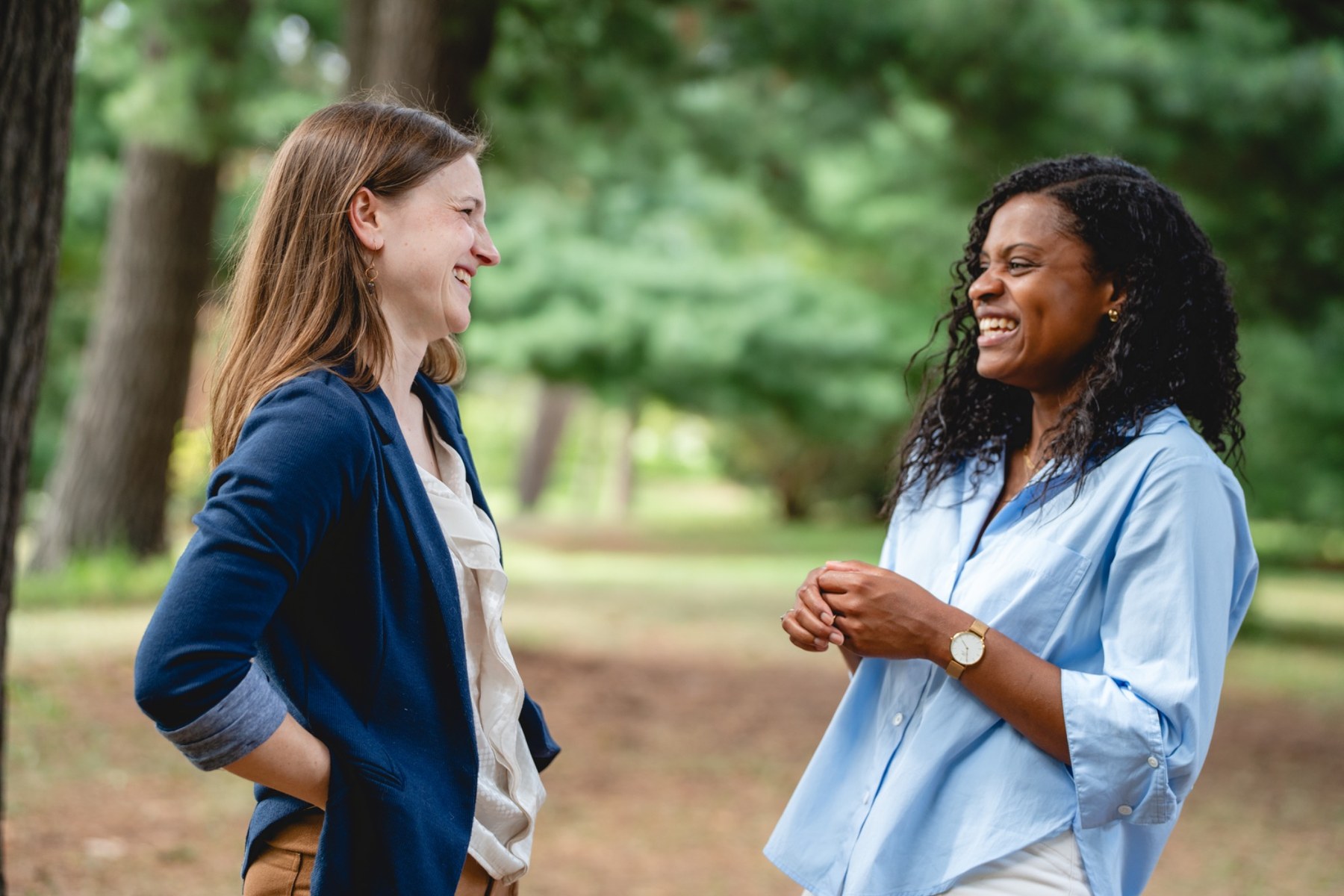 Katie Ticho and Raevhann Rush talking together outdoors